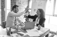 Two people giving each other a high five